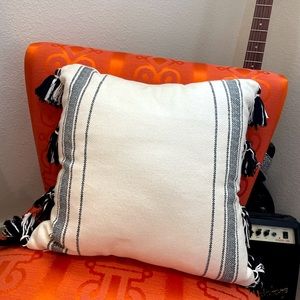 urban outfitters cream throw pillow with stripes and tassels